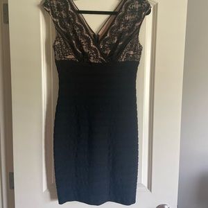Adrianna Papell black tired dress. Lace surplice top with nude lining.